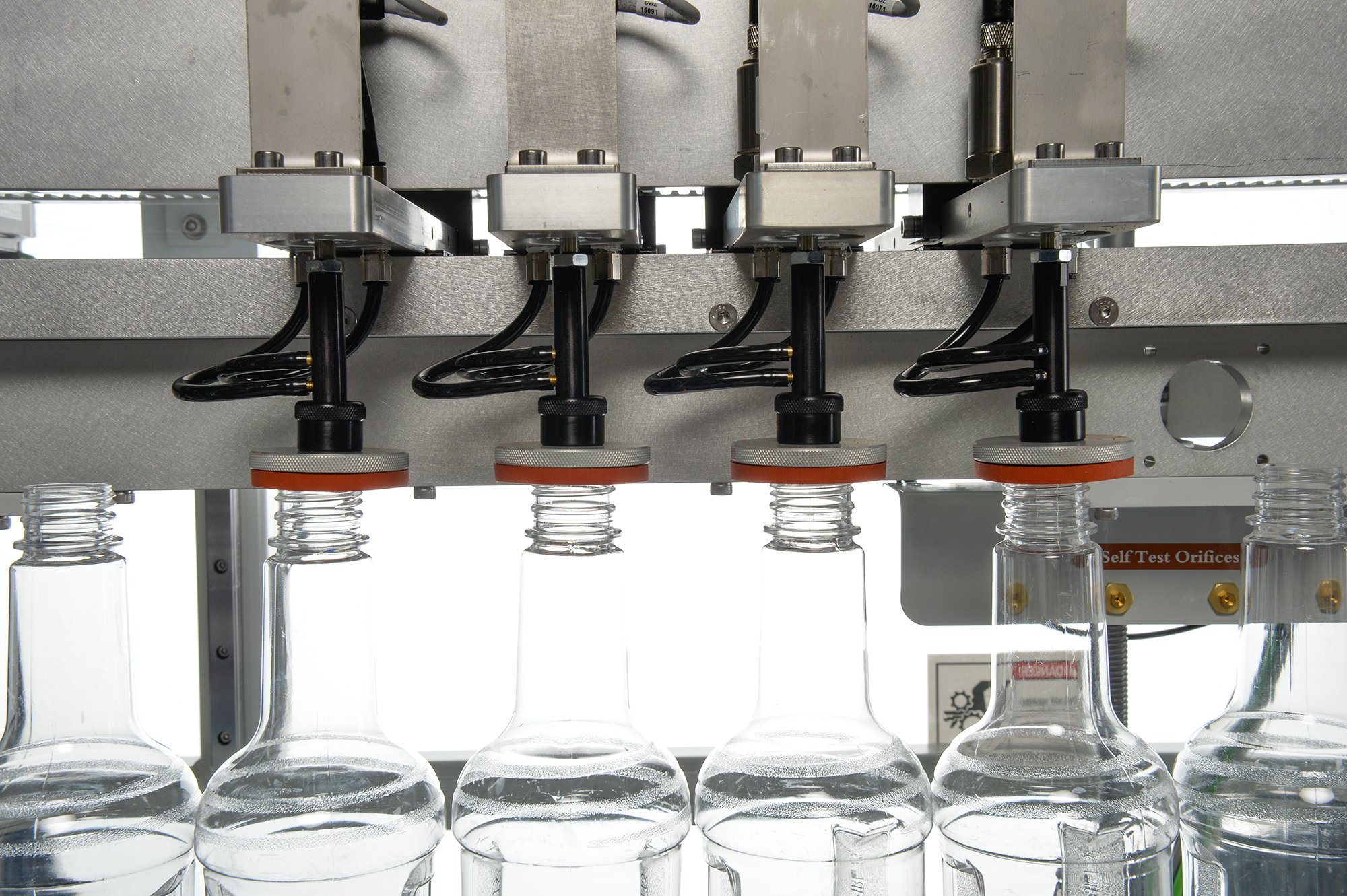Pressure decay leak testing PET bottles